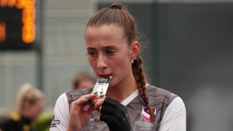 a hockey player eating a hydration gel product